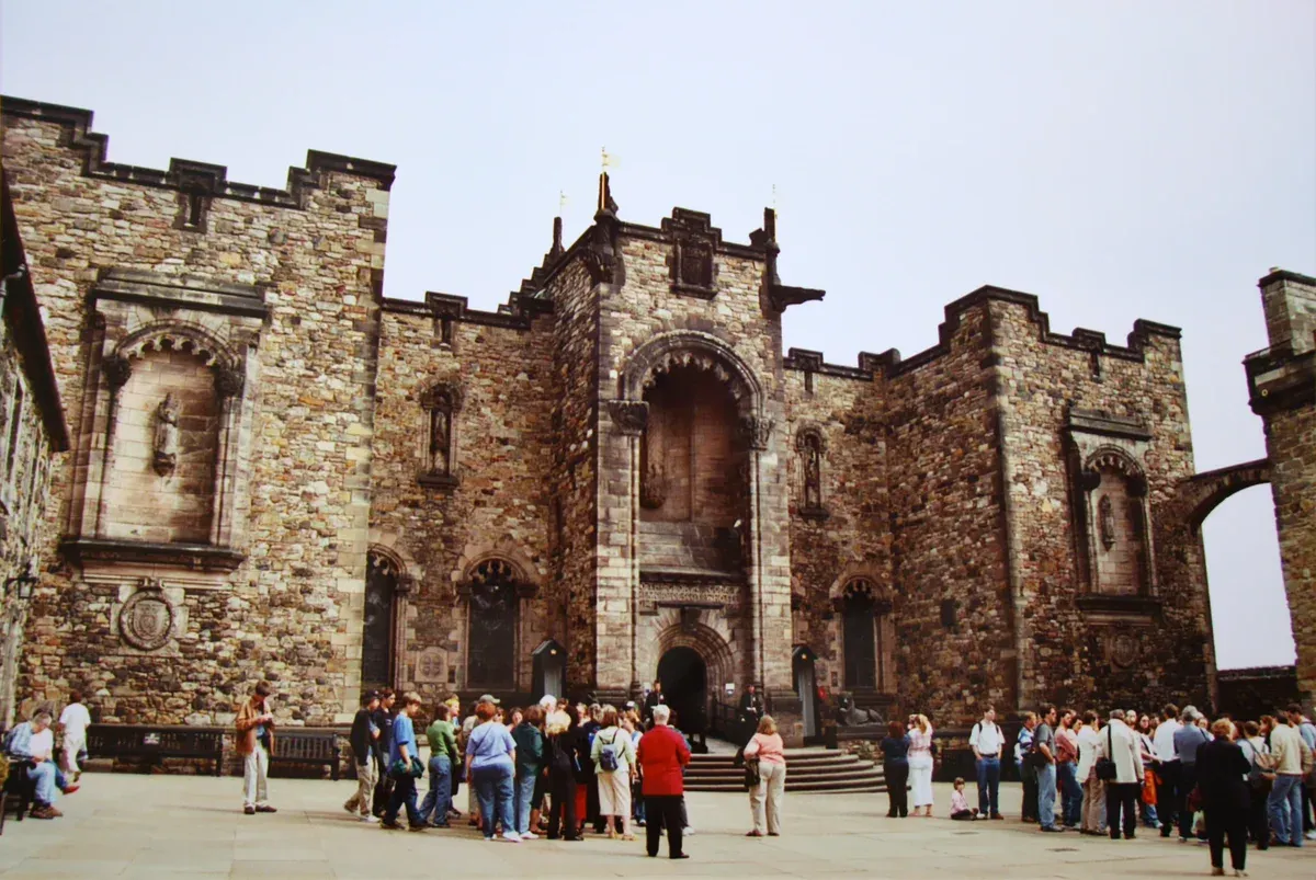 Visitors gathered in front of the stone buildings inside Edinburgh Castle, Edinburgh ghost tours, Edinburgh, Scotland