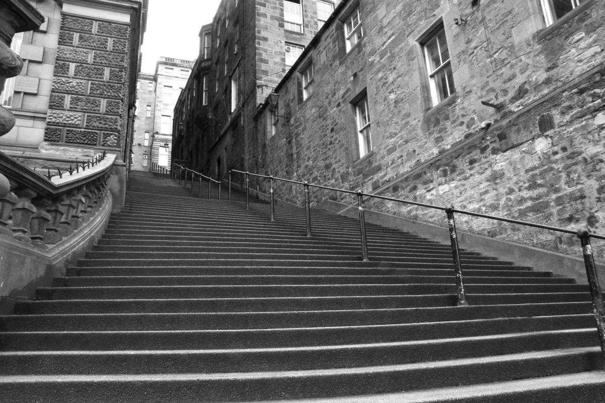 The stone stairs of Warriston's Close off the Royal Mile, beside the entrance to Mary King's Close, Edinburgh ghost tours, Edinburgh, Scotland